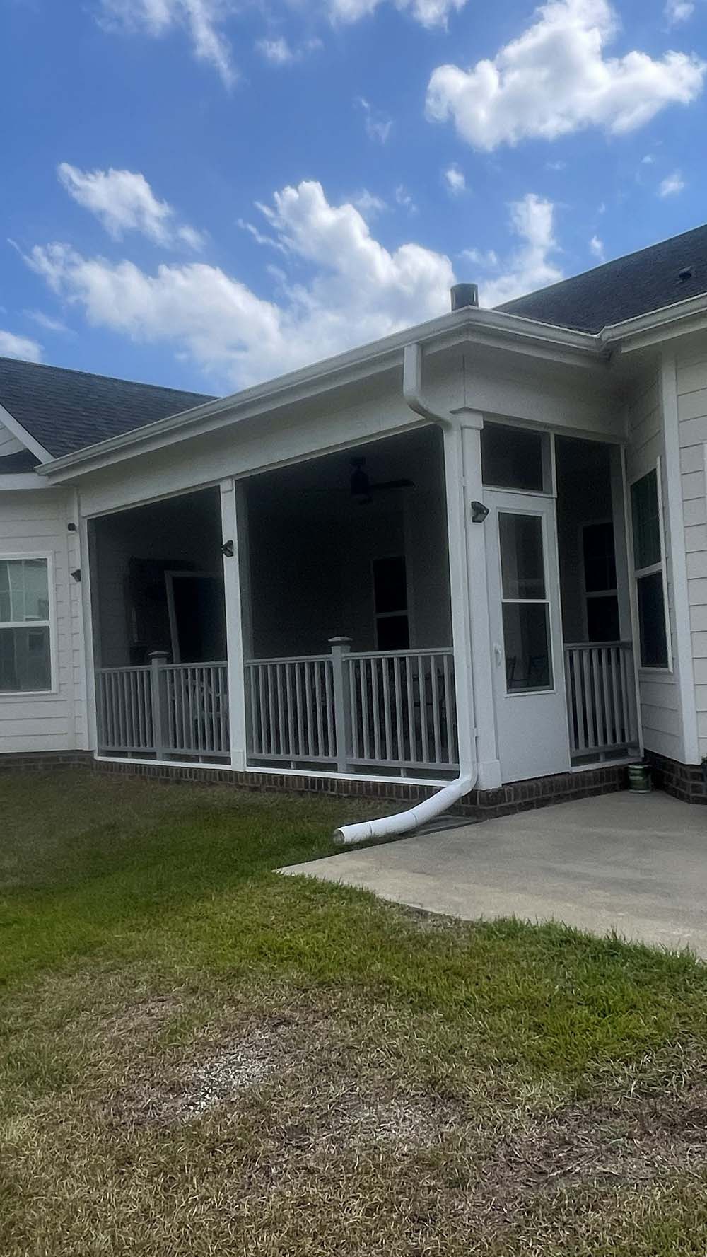 Finished white screened patio with painted railings and trim in Fayetteville NC